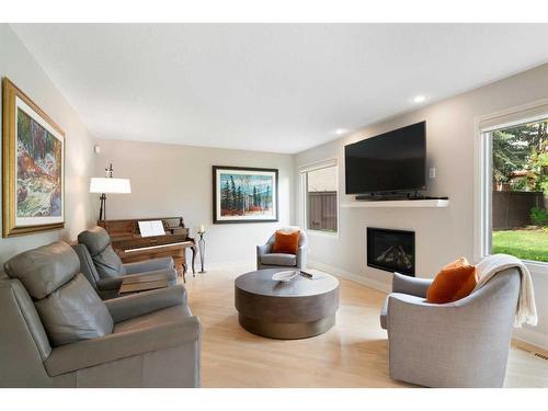 5970 Signal Ridge Heights Sw, Calgary, AB - Indoor Photo Showing Living Room With Fireplace