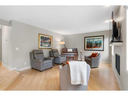 5970 Signal Ridge Heights Sw, Calgary, AB - Indoor Photo Showing Living Room With Fireplace