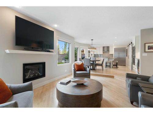 5970 Signal Ridge Heights Sw, Calgary, AB - Indoor Photo Showing Living Room With Fireplace