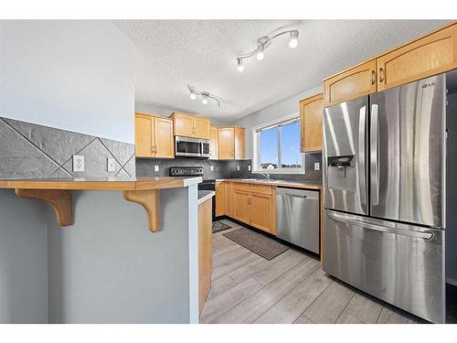 140 Eversyde Boulevard Sw, Calgary, AB - Indoor Photo Showing Kitchen With Stainless Steel Kitchen