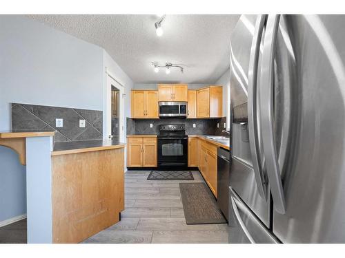 140 Eversyde Boulevard Sw, Calgary, AB - Indoor Photo Showing Kitchen With Stainless Steel Kitchen