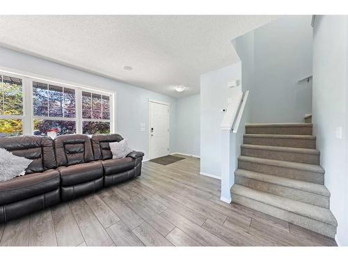 140 Eversyde Boulevard Sw, Calgary, AB - Indoor Photo Showing Living Room