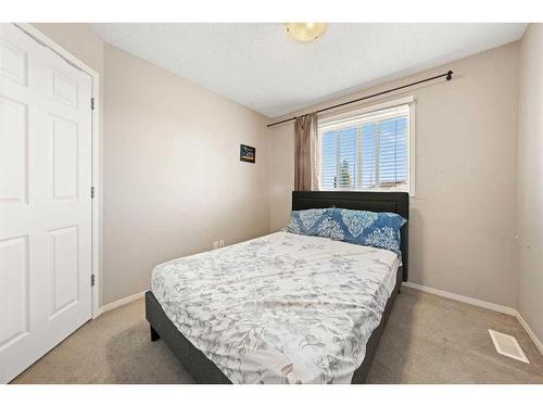 140 Eversyde Boulevard Sw, Calgary, AB - Indoor Photo Showing Bedroom