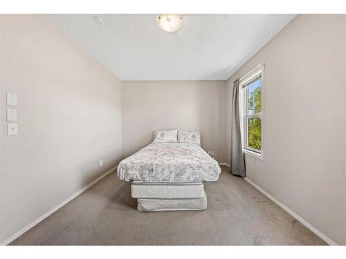 140 Eversyde Boulevard Sw, Calgary, AB - Indoor Photo Showing Bedroom