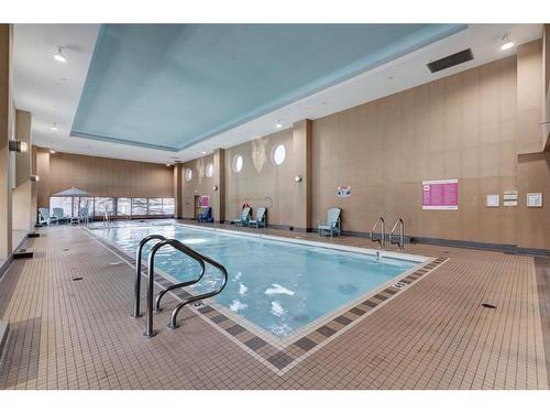 406-55 Spruce Place Sw, Calgary, AB - Indoor Photo Showing Other Room With In Ground Pool