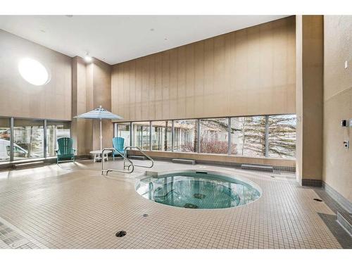 406-55 Spruce Place Sw, Calgary, AB - Indoor Photo Showing Other Room With In Ground Pool