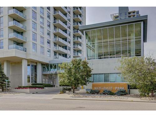 406-55 Spruce Place Sw, Calgary, AB - Outdoor With Balcony With Facade