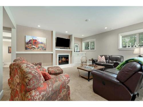 249 Elbow Ridge Haven, Rural Rocky View County, AB - Indoor Photo Showing Living Room With Fireplace