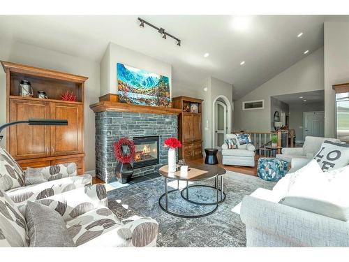 249 Elbow Ridge Haven, Rural Rocky View County, AB - Indoor Photo Showing Living Room With Fireplace