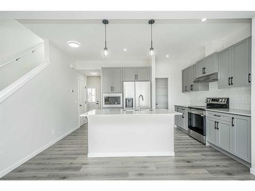 958 Bayview Rise Sw, Airdrie, AB - Indoor Photo Showing Kitchen With Upgraded Kitchen