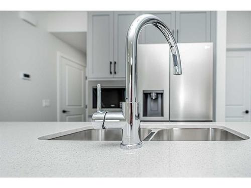 958 Bayview Rise Sw, Airdrie, AB - Indoor Photo Showing Kitchen With Double Sink