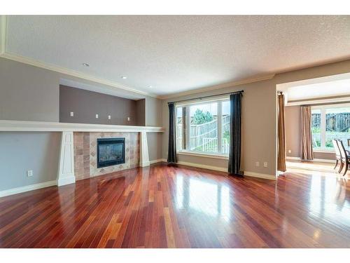 123 Arbour Crest Rise Nw, Calgary, AB - Indoor Photo Showing Living Room With Fireplace