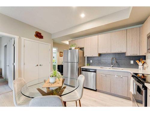 213-214 Sherwood Square Nw, Calgary, AB - Indoor Photo Showing Kitchen With Stainless Steel Kitchen