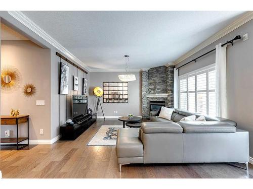 51 Evergreen Manor Sw, Calgary, AB - Indoor Photo Showing Living Room With Fireplace