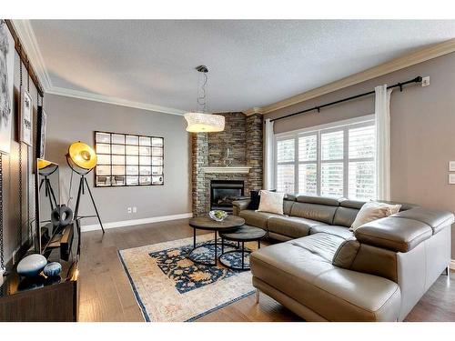 51 Evergreen Manor Sw, Calgary, AB - Indoor Photo Showing Living Room With Fireplace