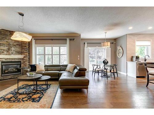 51 Evergreen Manor Sw, Calgary, AB - Indoor Photo Showing Living Room With Fireplace