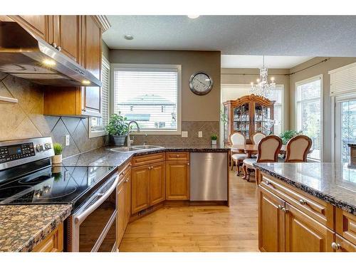 105 Everglade Circle Sw, Calgary, AB - Indoor Photo Showing Kitchen With Stainless Steel Kitchen With Double Sink