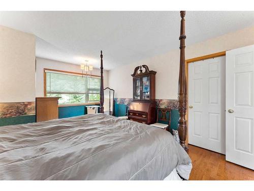 268 Rocky Ridge Bay Nw, Calgary, AB - Indoor Photo Showing Bedroom