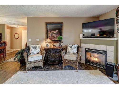 204-4000 Citadel Meadow Point Nw, Calgary, AB - Indoor Photo Showing Living Room With Fireplace