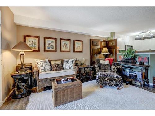 204-4000 Citadel Meadow Point Nw, Calgary, AB - Indoor Photo Showing Living Room With Fireplace