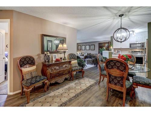 204-4000 Citadel Meadow Point Nw, Calgary, AB - Indoor Photo Showing Living Room With Fireplace