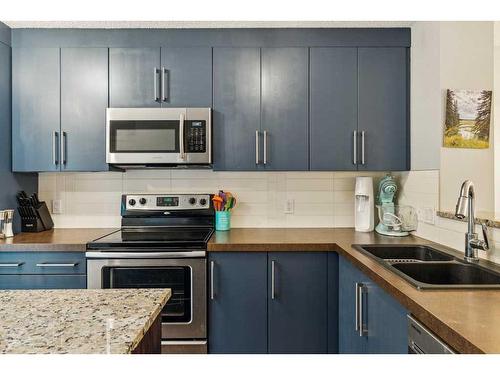 89 Aspen Hills Drive Sw, Calgary, AB - Indoor Photo Showing Kitchen With Double Sink With Upgraded Kitchen