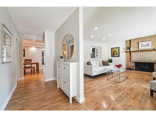 5128 Viceroy Drive Nw, Calgary, AB - Indoor Photo Showing Living Room With Fireplace