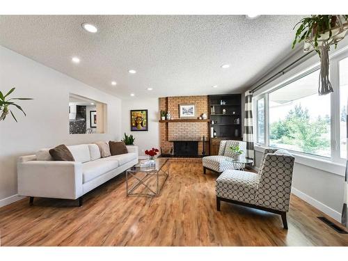 5128 Viceroy Drive Nw, Calgary, AB - Indoor Photo Showing Living Room With Fireplace