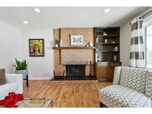 5128 Viceroy Drive Nw, Calgary, AB - Indoor Photo Showing Living Room With Fireplace