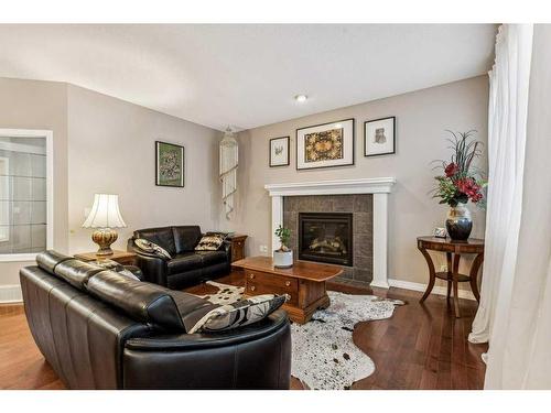 47 Panamount Road Nw, Calgary, AB - Indoor Photo Showing Living Room With Fireplace