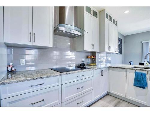 7 Kingsbury Close Se, Airdrie, AB - Indoor Photo Showing Kitchen With Upgraded Kitchen