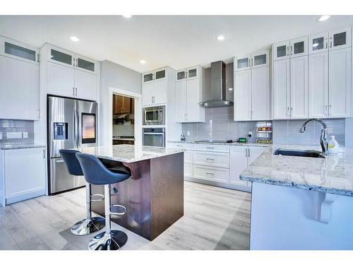 7 Kingsbury Close Se, Airdrie, AB - Indoor Photo Showing Kitchen With Upgraded Kitchen