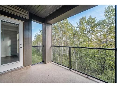 110-45 Aspenmont Heights Sw, Calgary, AB - Outdoor With Balcony With Exterior