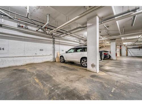 110-45 Aspenmont Heights Sw, Calgary, AB - Indoor Photo Showing Garage