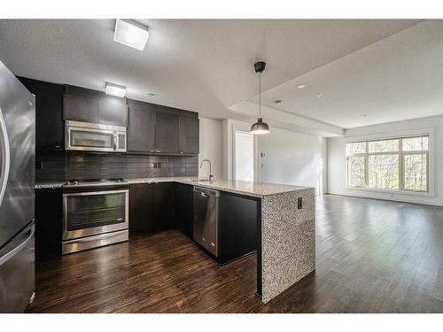 110-45 Aspenmont Heights Sw, Calgary, AB - Indoor Photo Showing Kitchen With Stainless Steel Kitchen With Upgraded Kitchen