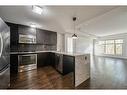 110-45 Aspenmont Heights Sw, Calgary, AB  - Indoor Photo Showing Kitchen With Stainless Steel Kitchen With Upgraded Kitchen 