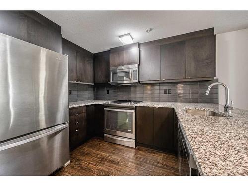 110-45 Aspenmont Heights Sw, Calgary, AB - Indoor Photo Showing Kitchen With Stainless Steel Kitchen With Upgraded Kitchen