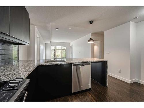 110-45 Aspenmont Heights Sw, Calgary, AB - Indoor Photo Showing Kitchen With Upgraded Kitchen