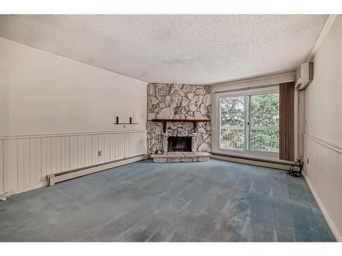 309-1001 68 Avenue Sw, Calgary, AB - Indoor With Fireplace