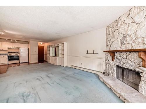 309-1001 68 Avenue Sw, Calgary, AB - Indoor With Fireplace