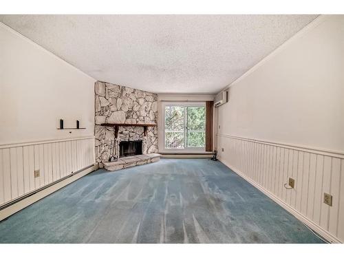 309-1001 68 Avenue Sw, Calgary, AB - Indoor With Fireplace