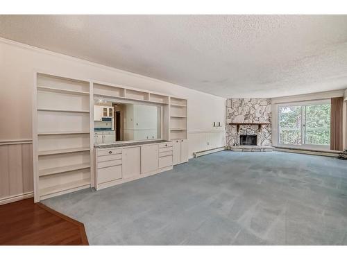 309-1001 68 Avenue Sw, Calgary, AB - Indoor With Fireplace