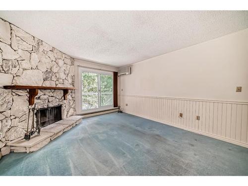 309-1001 68 Avenue Sw, Calgary, AB - Indoor With Fireplace