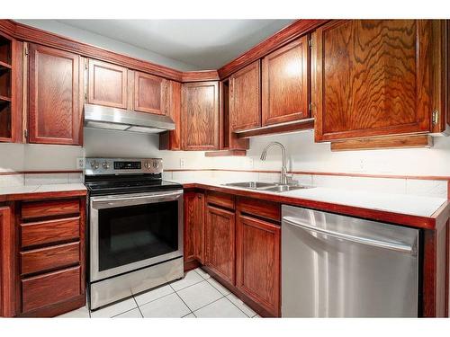 309-2611 1 Avenue Nw, Calgary, AB - Indoor Photo Showing Kitchen With Double Sink