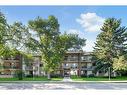 309-2611 1 Avenue Nw, Calgary, AB  - Outdoor With Balcony With Facade 