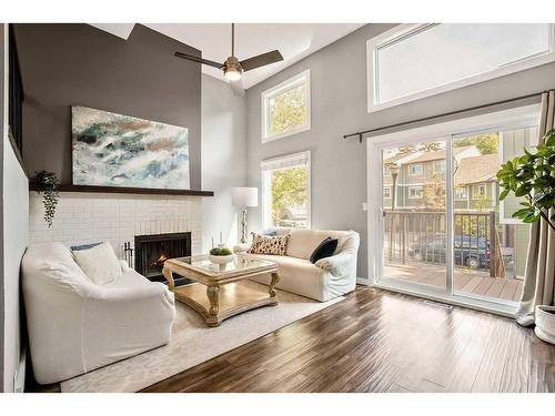 8-8533 Silver Springs Road Nw, Calgary, AB - Indoor Photo Showing Living Room With Fireplace