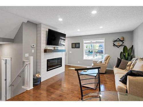 129 Chaparral Valley Drive Se, Calgary, AB - Indoor Photo Showing Living Room With Fireplace