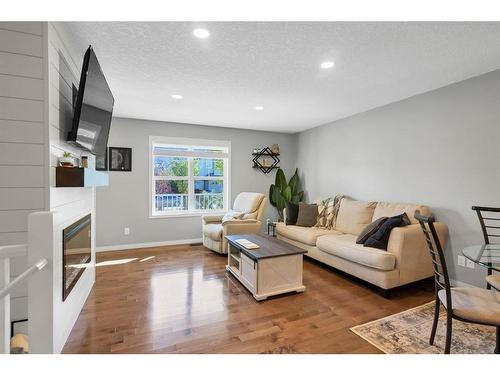 129 Chaparral Valley Drive Se, Calgary, AB - Indoor Photo Showing Living Room With Fireplace