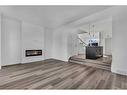 46 Herron Street Ne, Calgary, AB  - Indoor Photo Showing Living Room With Fireplace 