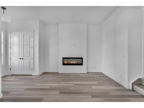 46 Herron Street Ne, Calgary, AB - Indoor With Fireplace